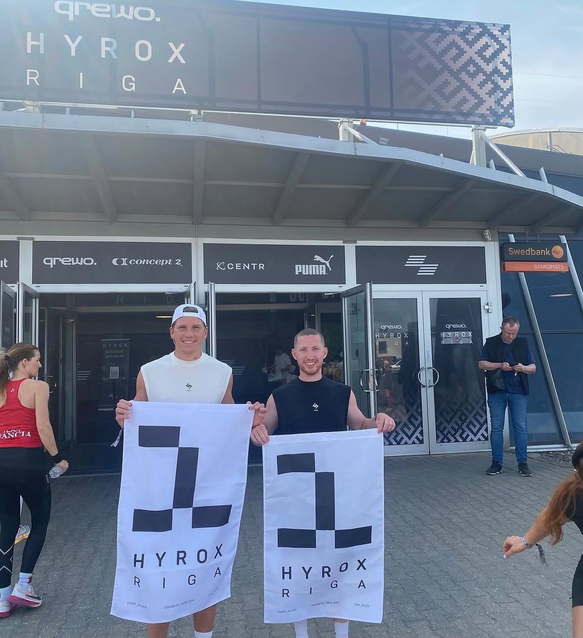 Holding first-place flags at Hyrox Riga